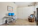 Bright, flex space with hardwood floors and a murphy bed/cabinet at 1604 Still River Dr, Venice, FL 34293