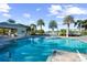 Enjoy the sunshine with a refreshing dip in this amazing pool, surrounded by lush landscaping and a cabana at 1604 Still River Dr, Venice, FL 34293