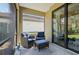 Relaxing screened porch with comfortable seating and a view of the lovely backyard at 1604 Still River Dr, Venice, FL 34293