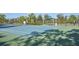 Enjoy a match on this well-maintained tennis court, complete with shaded seating for relaxing between sets at 1604 Still River Dr, Venice, FL 34293