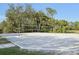 Get active on this sandy volleyball court surrounded by lush trees, perfect for outdoor fun at 1604 Still River Dr, Venice, FL 34293