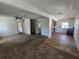 View from the living room to kitchen and bathroom; ceiling fan visible at 1666 23Rd St, Sarasota, FL 34234