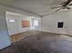 Living room with a white front door, a window, and a ceiling fan at 1666 23Rd St, Sarasota, FL 34234