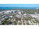 Wide aerial view showing the property's location near water and a vibrant cityscape at 2130 Temple St, Sarasota, FL 34239
