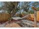 Serene backyard featuring a hammock and lush greenery at 2130 Temple St, Sarasota, FL 34239