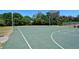 Outdoor basketball court with well-maintained surface, hoops, and clear markings, perfect for sports and recreation at 2130 Temple St, Sarasota, FL 34239