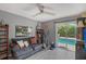 Cozy living room with slider to pool and patio, ceiling fan, and open layout at 2130 Temple St, Sarasota, FL 34239