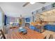 Open-concept kitchen and living space featuring a dining table, copper sink, tv, and comfortable furniture at 2130 Temple St, Sarasota, FL 34239