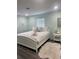 Comfortable bedroom featuring a plush bed, soft lighting, and a serene color scheme at 2180 Orchid St, Sarasota, FL 34239