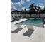 Backyard pool with lounge chairs, dining area and hammock, perfect for relaxing and entertaining at 2180 Orchid St, Sarasota, FL 34239