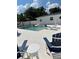 Inviting pool area with modern patio furniture and ample space for relaxation and entertainment at 2180 Orchid St, Sarasota, FL 34239