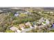 Stunning aerial view of the neighborhood, showcasing the lush landscaping, ponds, and well-maintained homes at 2515 130Th E Ave, Parrish, FL 34219