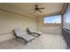 Relaxing screened balcony features two chaise lounges, neutral paint, and tile floor at 2515 130Th E Ave, Parrish, FL 34219