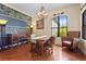 Formal dining room featuring hardwood floors and a decorative chandelier at 2515 130Th E Ave, Parrish, FL 34219