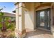 Home entrance featuring a column and brick walkway, along with well-maintained landscaping at 2515 130Th E Ave, Parrish, FL 34219