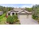 Beautiful home featuring a lush front yard, multi-car garage, neutral paint, and a tile roof at 2515 130Th E Ave, Parrish, FL 34219