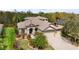 Beautiful exterior view of the home highlighting its tile roof, manicured landscaping, and inviting curb appeal at 2515 130Th E Ave, Parrish, FL 34219