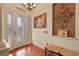 Inviting foyer with hardwood floors, decorative chandelier, and elegant leaded glass front door at 2515 130Th E Ave, Parrish, FL 34219