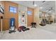Spacious home gym features mirrored wall, Total Gym workout machine and exercise equipment at 2515 130Th E Ave, Parrish, FL 34219