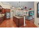 Open-concept kitchen flows to the living area with a central island and stainless steel appliances at 2515 130Th E Ave, Parrish, FL 34219