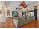 Inviting living room with wood flooring, comfortable seating, stylish ceiling fans, and blue accents at 2515 130Th E Ave, Parrish, FL 34219