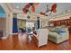 Spacious living room with wood floors, large sliding doors, stylish ceiling fans, and comfortable seating at 2515 130Th E Ave, Parrish, FL 34219