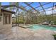 Screened-in pool area with spa and lounge area, ideal for enjoying outdoor living and entertaining at 2515 130Th E Ave, Parrish, FL 34219
