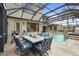 Screened-in pool area with outdoor dining space, great for entertaining and enjoying the outdoors at 2515 130Th E Ave, Parrish, FL 34219