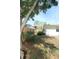 Fenced backyard with lush greenery offering privacy and a tranquil outdoor space to enjoy nature at 2696 Loma Linda St, Sarasota, FL 34239