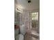 Bathroom featuring neutral tile and glass block window at 2696 Loma Linda St, Sarasota, FL 34239