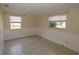 Standard bedroom with neutral color and two windows for plenty of natural light at 2696 Loma Linda St, Sarasota, FL 34239