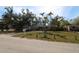 Charming home with a spacious front yard and driveway, offering curb appeal and convenient parking at 2696 Loma Linda St, Sarasota, FL 34239