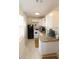 Efficient kitchen featuring granite countertops, modern appliances, and ample cabinet space for storage at 2696 Loma Linda St, Sarasota, FL 34239