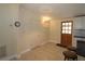 Cozy kitchen area featuring tile floors, modern lighting, and convenient access to the outdoors at 2696 Loma Linda St, Sarasota, FL 34239
