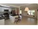 Modern kitchen with stainless steel appliances, granite countertops, and center island at 2696 Loma Linda St, Sarasota, FL 34239