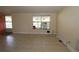 Neutral living area with a large window for natural light and views of the porch at 2696 Loma Linda St, Sarasota, FL 34239