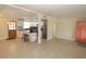 Spacious living room with tile floors and open layout, connecting to the modern kitchen at 2696 Loma Linda St, Sarasota, FL 34239