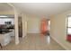 Bright living room featuring tile floors, a fresh paint job, and easy access to the kitchen at 2696 Loma Linda St, Sarasota, FL 34239