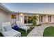 Outdoor oasis with lounge chairs, tropical landscaping, and stylish exterior lighting at 309 Avenida Milano, Sarasota, FL 34242