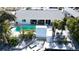 Aerial view of backyard featuring a pool, a lounging area, and tropical landscaping at 309 Avenida Milano, Sarasota, FL 34242