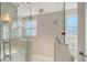 Gorgeous bathroom with a frameless glass shower and a bright white vanity at 309 Avenida Milano, Sarasota, FL 34242