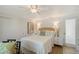 Cozy bedroom with ceiling fan and two doors at 309 Avenida Milano, Sarasota, FL 34242