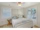 Bright bedroom with a ceiling fan and many windows at 309 Avenida Milano, Sarasota, FL 34242
