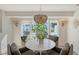 Dining area with view of backyard, chandelier and seating; bright natural light at 309 Avenida Milano, Sarasota, FL 34242