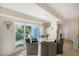 Dining area with view of backyard, chandelier and seating; bright natural light at 309 Avenida Milano, Sarasota, FL 34242