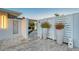 Entrance way to home with large potted plants and a brick-paved walkway at 309 Avenida Milano, Sarasota, FL 34242