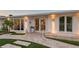 Stylish modern home entrance with exterior lighting and professionally landscaped walkway at 309 Avenida Milano, Sarasota, FL 34242
