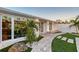Manicured front yard with a stone pathway and decorative landscaping leading to the entrance at 309 Avenida Milano, Sarasota, FL 34242