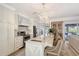 Kitchen featuring an eat-in kitchen island, barstool seating and stainless steel appliances at 309 Avenida Milano, Sarasota, FL 34242