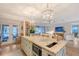 Spacious kitchen island has barstool seating with views to the living room and outdoor patio space at 309 Avenida Milano, Sarasota, FL 34242